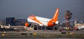 Airplane EasyJet airline lands on the runway in an aeroport El Prat city of Barcelona. Board number G-EZFZ