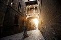 Barcelona people biking bicycle in Barri Gothic Quarter and Bridge of Sighs in Barcelona, Catalonia, Spain.. Royalty Free Stock Photo