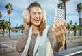 Woman on embankment in Barcelona taking selfie with smartphone Royalty Free Stock Photo