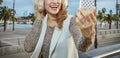 Woman on embankment in Barcelona taking selfie with smartphone Royalty Free Stock Photo