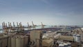 BARCELONA, SPAIN - APRIL, 15, 2017. Aerial shot of harbour cranes, port storage facility and big container yard