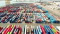 BARCELONA, SPAIN - APRIL, 15, 2017. Aerial shot of big port container yard and loader in action