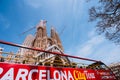 BARCELONA, SPAIN - April 25, 2018: Barcelona city tour touristic bus in front of famous Sagrada Familia Basilica yet not Royalty Free Stock Photo