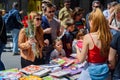 Barcelona, Spain - 23 April 2023: People are seen buying books while holding red roses during traditional catalan festivity of