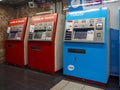 Three ticket machines in a subway station in Barcelona.