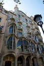 BARCELONA, SPAIN - AUG 30th, 2017: The curving shaped stone facade of Gaudi`s Casa Batllo, outdoor view on a sunny day Royalty Free Stock Photo