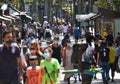 Barcelona, Spain, August 8, 2020: Crowd ot tourists wearing protective medical masks for prevent virus Covid-19 in Barcelona,