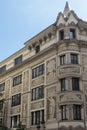 A historic townhouse in Barcelona boasts intricate drawings and ornaments on its facade