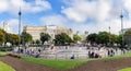 People are walking at Placa Catalunya in Barcelona, Spain. This square is considered to be the city center.