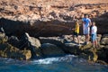 Barcelona, Spain, August 22, 2019: Three Brothers have fun fishing at the beach