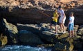 Barcelona, Spain, August 22, 2019: Three Brothers have fun fishing at the beach