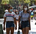 Barcelona, Spain, August 8, 2020: Tourists girls wearing protective medical masks for prevent virus Covid-19 in Barcelona, Spain,