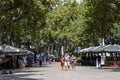 Barcelona, Spain, August 9, 2020: Tourists walking around in La Rambla wearing protective medical masks to prevent virus Covid-19