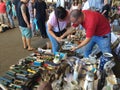 Barcelona, Spain - August 21, 2016: Visitors inspect examine various range of retro goods merchandise on flea market Royalty Free Stock Photo