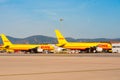 BARCELONA, SPAIN - AUGUST 20, 2016: Yellow cargo planes Boeing 757 from the logistics courier company DHL. Copy space for t