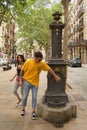 Barcelona, Spain - August 31, 2023: Young Couple at Fountain Button: Symbolizing Water Scarcity and Drought