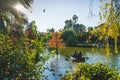 Barcelona, Spain - 24.11.2018: Beautiful day in Ciutadella Park, view of green trees and a boat with people in a small lake from Royalty Free Stock Photo