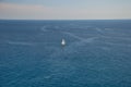 Barcelona, Spain - 18.08.2019: Beautiful white sailing yacht in the blue huge sea