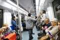 Barcelona metro on board view with people seated