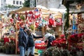 Barcelona, Spain Ã¢â¬â December 20, 2021: Christmas market on the square in front of Cathedral in Barcelona, couple in the mask sele