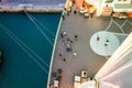 Lounge promenade deck on cruise ship. Interior of luxury cruise restaurant with tables and armchair in sunset at sea Royalty Free Stock Photo