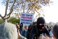 Barcelona, Spain - 21 decemer 2018: young catalan independist with balaklava, called Cdr, clash with police during a cabinet