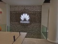 Barcelona, Spain - 26. February 2020: HUAWEI logo on the wall in HUAWEI experience store in Barcelona Royalty Free Stock Photo