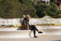 A woman reads a book in Guell Park, Barcelona