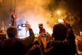 Barcelona, Spain - 5 january 2020: a child watches the traditional cabalgata de reyes at night in the crowd, a catalan tradition