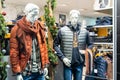 Barcelona, Spain-January 4, 2022. Men's clothing, sweaters, trousers, shirts, in a shop window with mannequins for sale. Royalty Free Stock Photo
