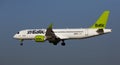 Plane Airbaltic airline lands on the runway in an aeroport El Prat city of Barcelona