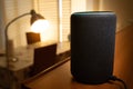 Barcelona, Spain. January 2019: Selective focus on Amazon Echo Plus smart Home device turning on a floor lamp