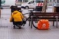 Barcelona, Spain - January 7th 2020. Home delivery man preparing his yellow backpack