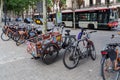 Vintage funny three wheels cargo bike parked in the street. Concept of environmentally sustainable transport