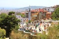 BARCELONA, SPAIN - JULY 12, 2018: Park Guell people on terrace with balconies decorated by Antoni Gaudi mosaics, Barcelona, Spain