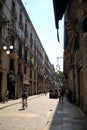 Barcelona, Spain - July 4, 2015: People walking and cycling on the street