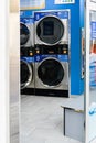 Barcelona, Spain - July 4, 2021. Washing machines in a self-service laundry. Washing clothes outside the home Royalty Free Stock Photo