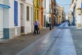 Barcelona, Spain- June 6, 2023. Elderly disabled patient walking slowly with a walker in the street. Elderly disabled adults feel