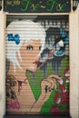 BARCELONA, SPAIN - JUNE 2, 2013: Portrait of a beautiful young blonde girl painted on the door