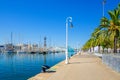 Promenade embankment of Barcelona with moored yacht boats in port