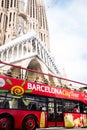 Barcelona, spain -  20 june 2019: touristic sightseeing bus in front of sagrada familia landmark cathedral, symbol of mass tourism Royalty Free Stock Photo