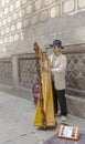 Unknown street harpist on one of the streets in old downtown. Royalty Free Stock Photo