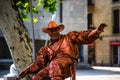 Barcelona, Spain Ã¢â¬â 2019. Man dressed as cowboy gives live statue performance at famous La Rambla street