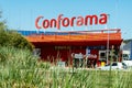Barcelona, Spain - March 21, 2021. Logo and facade of Conforama, the second largest home furnishings retail chain in Europe with