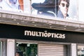 Barcelona, Spain - March 21, 2021. Logo and facade of Multiopticas, MO, optical stores