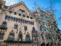 Low angle dramatic view of the facades of the famous Gaudi`s house Casa Batllo Royalty Free Stock Photo