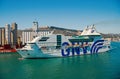 Barcelona, Spain - March 30, 2016: ship or liner GNV Rhapsody Genova in sea harbor on mountain landscape. Cruise ship
