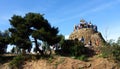 Tourists in Barcelona in the Park Guell at Calvary three crosses.