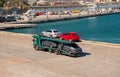 Barcelona, Spain - March 30, 2016: tow truck carry Seat and Mercedes cars in sea port. Auto export and import trade Royalty Free Stock Photo