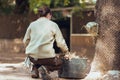 Barcelona, Spain, on May 2017 - Animal keeper putting food into herbivore feeder